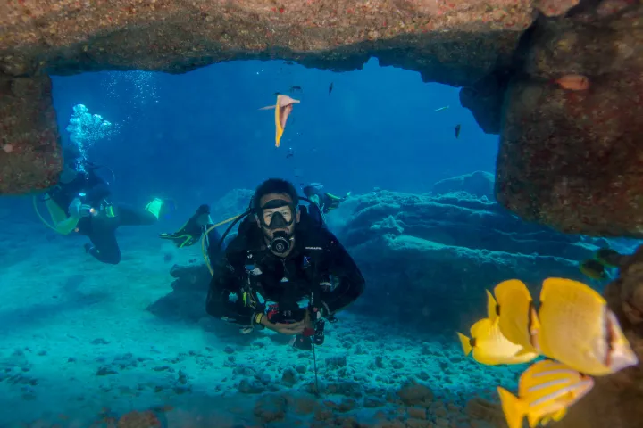 scuba diver diving in an underwater cave