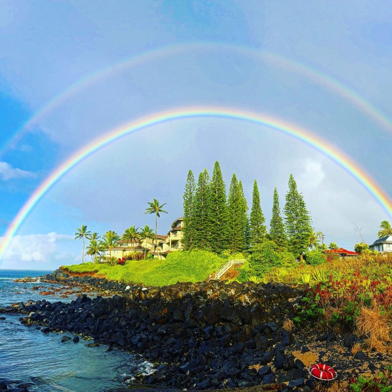 a rainbow over a body of water